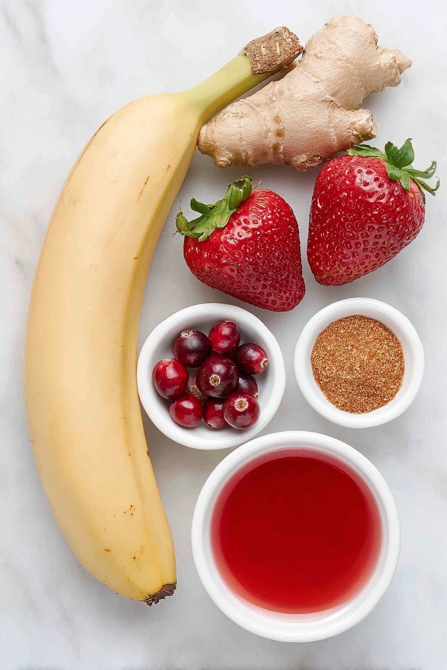 Flat lay of a peeled whole banana, a small heap of fresh red cranberries, three ripe strawberries with green leaves, a small white ceramic bowl filled with bright red cranberry juice, a tiny white bowl holding ground cinnamon, a tiny white bowl with ground fresh ginger, all arranged in perfect symmetry on a clean white marble surface, soft natural light, photo taken with an iPhone, professional food photography style, fresh ingredients, white ceramic bowls, no bottles, no duplicates, no utensils, no packaging --ar 2:3 --v 7 --p m7354615311229779997