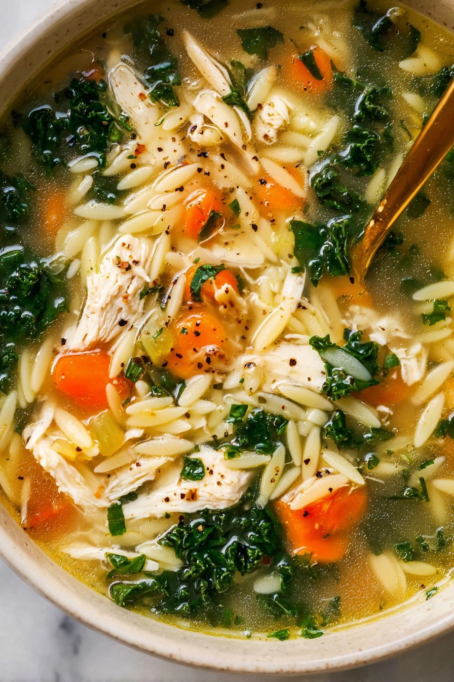 A white bowl filled with chicken soup showing many layers: white small pasta pieces at the bottom mixed with shredded white chicken pieces, bright orange carrot chunks scattered evenly, dark green kale leaves sitting on top, translucent celery pieces, all floating in light yellow broth with specks of black pepper and green herbs. A long golden spoon stands in the soup and some green herbs are sprinkled around the bowl on a white marbled surface, next to a striped cloth and another white bowl with chopped green herbs. photo taken with an iphone --ar 2:3 --v 7
