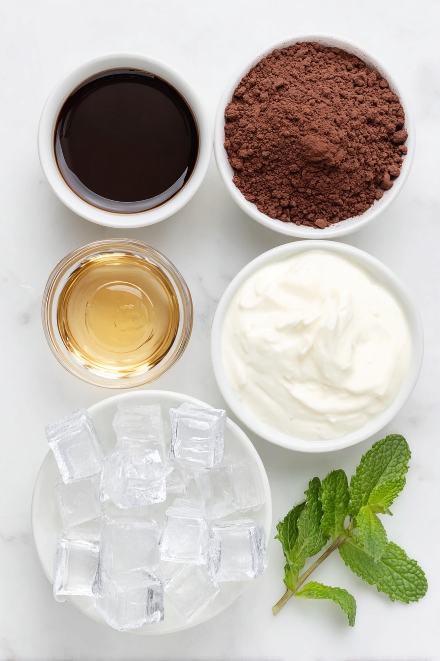 Flat lay of a small white ceramic bowl of dark ground espresso, a small white ceramic bowl filled with rich brown cocoa powder, a small white ceramic bowl holding golden amber maple syrup, a few fresh green peppermint leaves, a small white ceramic bowl of creamy white milk, and a handful of clear ice cubes arranged neatly, all placed on a clean white marble surface, soft natural light, photo taken with an iPhone, professional food photography style, fresh ingredients, white ceramic bowls, no bottles, no duplicates, no utensils, no packaging --ar 2:3 --v 7 --p m7354615311229779997