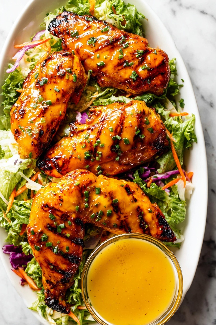 The image shows several thick slices of grilled chicken arranged closely together on a white marbled surface. The chicken has a golden brown, slightly charred outer layer with bright yellow-orange sauce drizzled over it. Finely chopped green herbs are sprinkled on top, adding contrast and texture. On the upper right side, there is a small glass bowl filled with more of the same yellow-orange sauce. The chicken slices show a juicy and tender white inside with a well-cooked grilled crust. Photo taken with an iphone --ar 2:3 --v 7